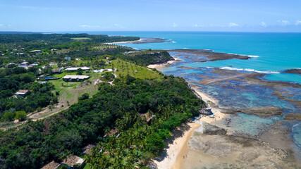 Aerial view of Praia do Espelho, Porto Seguro, Bahia, Brazil. Natural pools in the sea, cliffs and greenish water