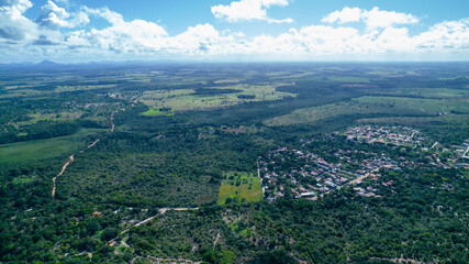 Fototapeta premium Aerial view of Caraiva beach, Porto Seguro, Bahia, Brazil. Colorful beach tents, sea and river