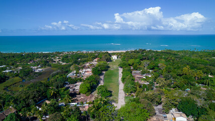 Obraz premium Aerial view of Trancoso, Porto Seguro, Bahia, Brazil. Small chapel in the historic center of Trancoso, called Quadrado. With the sea in the background