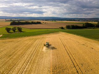 Aerial drone view of a harvester in Germany, close to Frankfurt