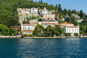Fototapeta na wymiar Views of various houses, (home) mansions and nostalgic buildings from the sea on the Bosphorus, on the Asia side of Istanbul. Residence by the sea.