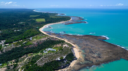 Aerial view of Praia do Espelho, Porto Seguro, Bahia, Brazil. Natural pools in the sea, cliffs and greenish water