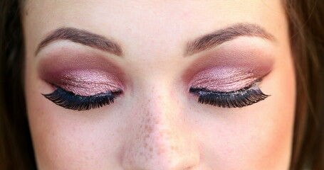 Naklejka premium Pretty girl macro eyes with eyelashes looking down thinking