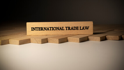 international trade law written on wooden surface. Law and state