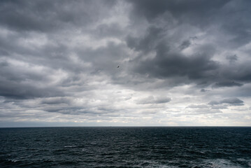 dramatic clouds from the sea before the storm , view from the beach , text sticking area