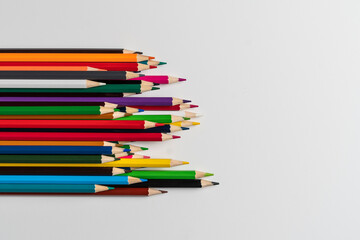 Fototapeta premium bunch of colored pencils flat lay view from above