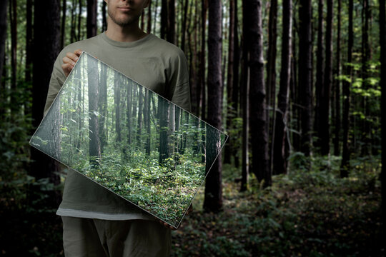 Fototapeta person holding a square frame with a backround painting, surreal creative concept