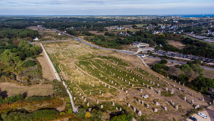 Aerial view of the Carnac stone alignments of Ménec in Morbihan, France - Prehistoric menhirs and megaliths in rows in Brittany - obrazy, fototapety, plakaty