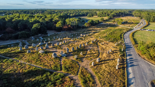 Aerial view of the Carnac stone alignments of Kermario in Morbihan, France - Prehistoric menhirs and megaliths in rows in Brittany