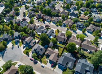 View from above showing houses on a street - obrazy, fototapety, plakaty