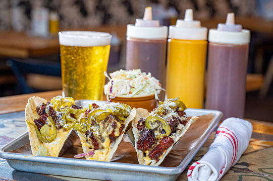 Bacon Burnt Ends Tacos With Cilantro, Slaw, Queso And Candied Jalapenos