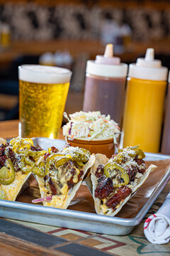 Bacon Burnt Ends Tacos With Cilantro, Slaw, Queso And Candied Jalapenos