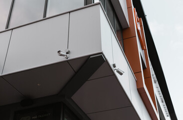 surveillance cameras on the facade of the house