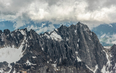 Mountain Range with Snow and Clouds
