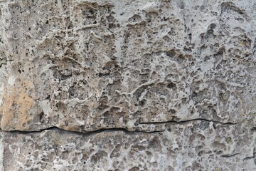 Obraz na płótnie Canvas Closeup view of grey stone texture as background
