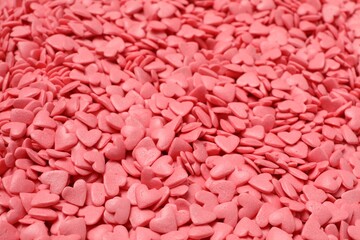 Sweet candy hearts as background, closeup view