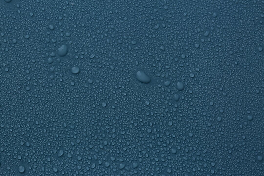 Many Water Drops On Dark Dusty Blue Background