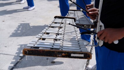 a member of the marching band playing the Glockenspiel Xylophone - obrazy, fototapety, plakaty