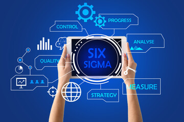 Hands with tablet computer and virtual screen on blue background. 6 sigma concept