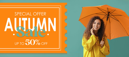Beautiful African-American woman in raincoat and with umbrella on green background. Banner for...