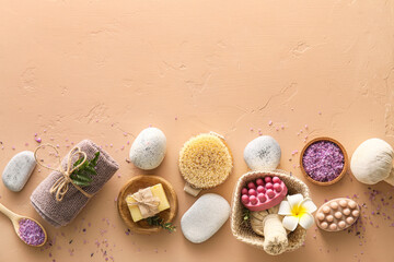 Fototapeta na wymiar Set of bath supplies with massage soap on color background