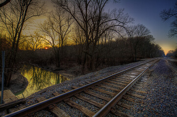 Fototapeta na wymiar A winter sunset over Clines Branch at the Seventy-Six Conservation area in Perry County Missouri. 