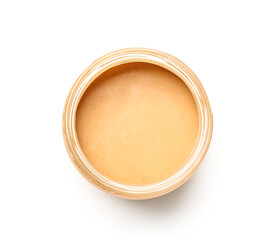 Jar of tasty nut butter on white background