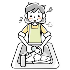 疲れた表情で食器洗いをするシニア女性