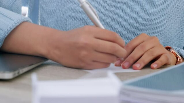 Writing, hands and sticky note reminder at desk for important business information management. Working girl with paper memo to remember meeting date on pad for professional organisation.