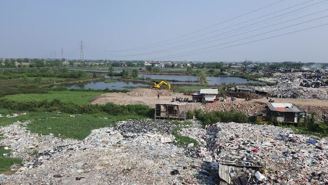Jakarta, Indonesia in August 2022. An illegal garbage dump on the bank of the East Flood Canal.