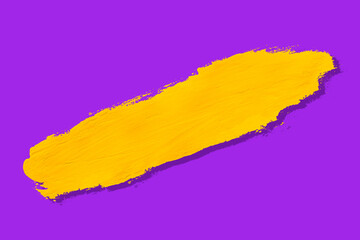yellow brush and shadow isolated on a purple background