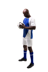 Full length of young male african american soccer player holding ball over white background