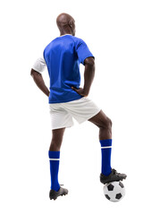 Rear view of young male african american soccer player stepping on ball over white background