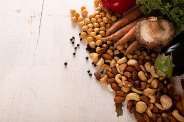 High angle view of various healthy food and ingredients on white table, copy space