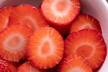 Full frame shot of sliced fresh red strawberries with copy space
