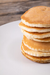 Close-up of tempting pancakes stacked in plate