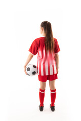 Full length rear view of caucasian young female player with soccer ball against white background