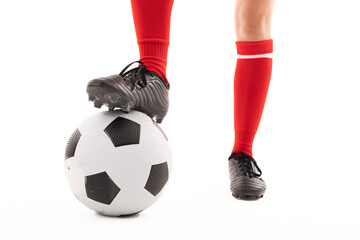 Low section of caucasian young female player with foot on soccer ball against white background - Powered by Adobe