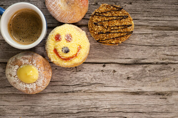Smiley face donut decorating among the other tasty donuts