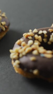 Video of donuts with chocolate on grey background