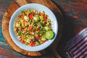 healthy sprout salad with mung bean sprout,chopped onion,tomato and boiled potato. 