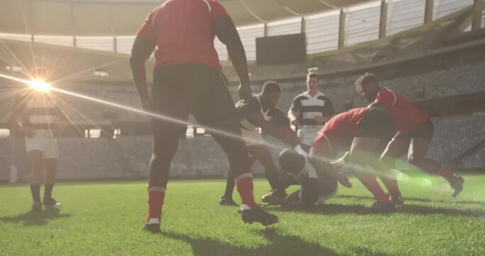 Animation of glowing lights over diverse rugby players in sports stadium