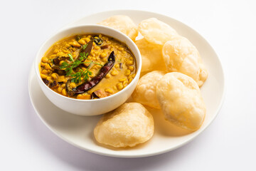 Luchi Cholar Dal or Fried bread made of flour served along with curried Chana or Bengal gram