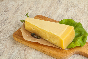 Traditional delicous Parmesan cheese over borad