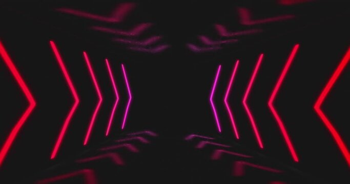 Animation of red and pink neon light lines moving in hypnotic motion on black background