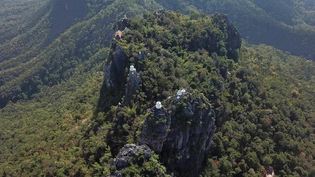 Aerial view of the sky pagodas on limestone mountains in Wat Chaloem Phra Kiat Phrachomklao Rachanusorn temple in Lampang province of Thailand.