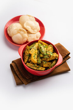 Aloo Patol sabzi made using pointed gourd and potato served with fried Luchi or poori, Bengali food