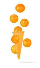 Isolated clementine on the air in ice cream waffle cone