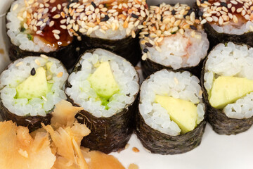 Sushi uramaki with different filling, close-up