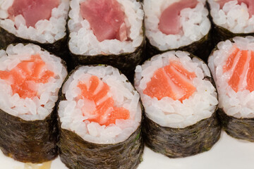 Sushi uramaki with different fish, close-up